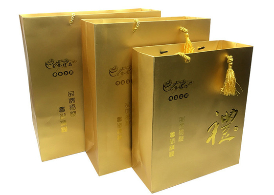 Ein guter Preis. Kundenspezifische Luxusdruckgoldpapier-Geschenk-Taschen mit prägeartigen Logo Tassel-Griffen Online
